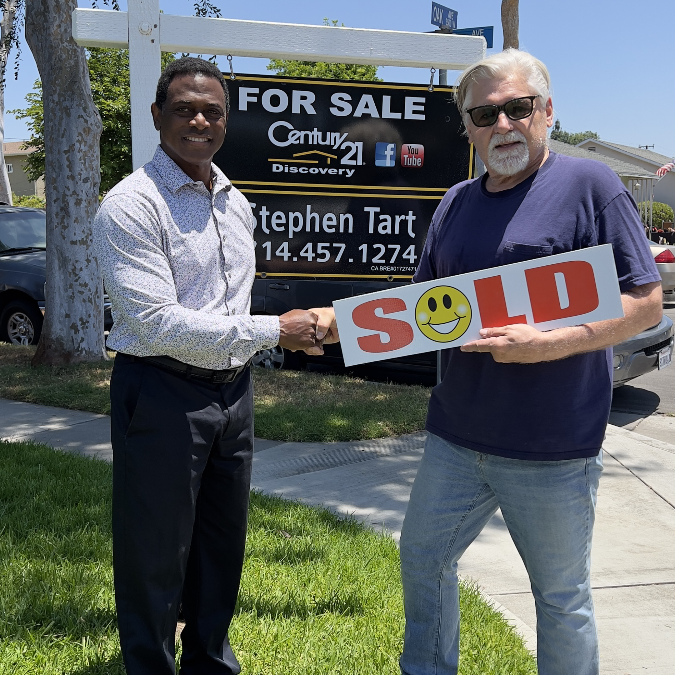 Real estate agent helping a happy client sell a home in Orange County